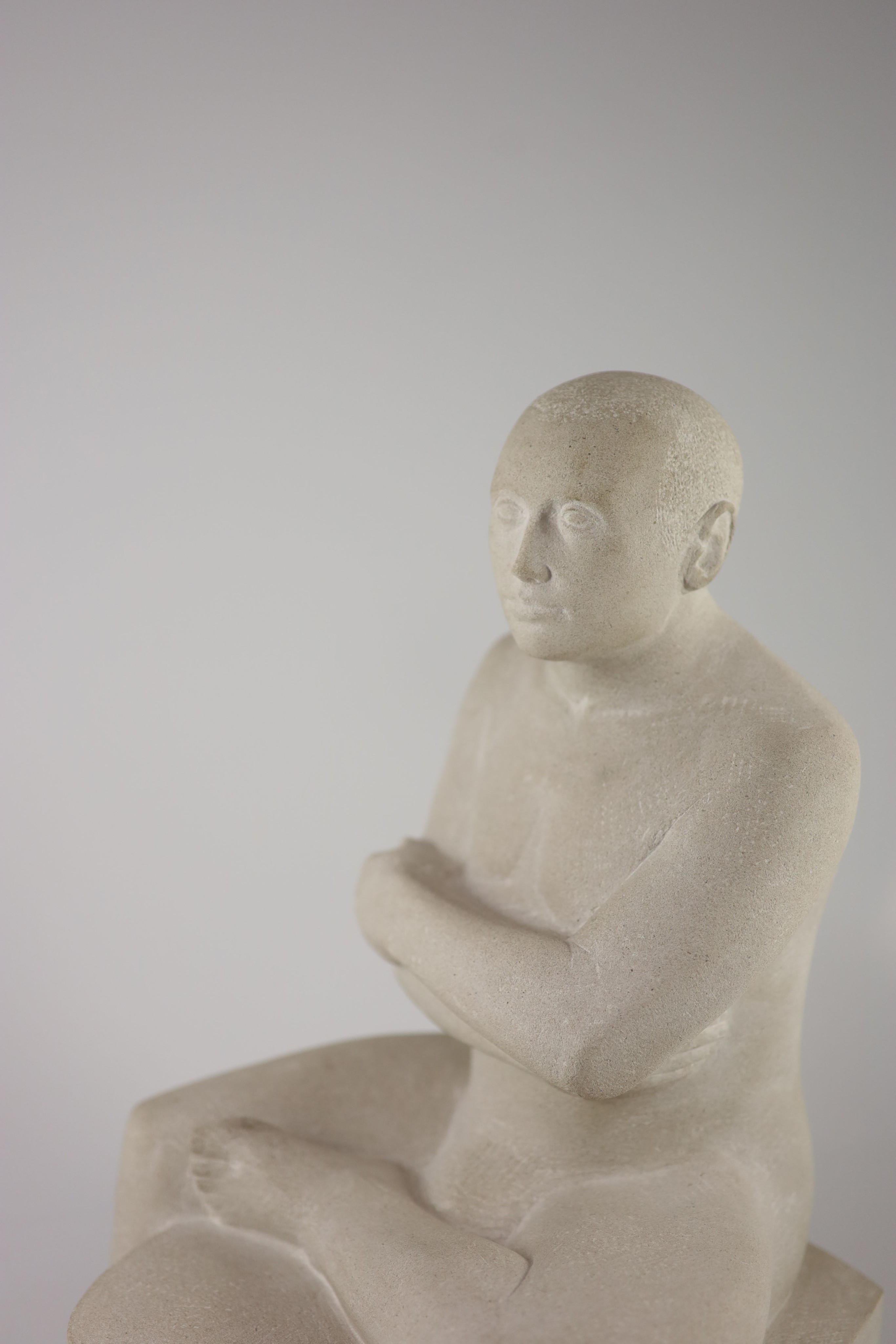 Andre Wallace FRSS, (1947-), Seated male bather, Portland stone, 45.5cm high